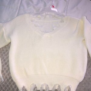 White ripped sweater